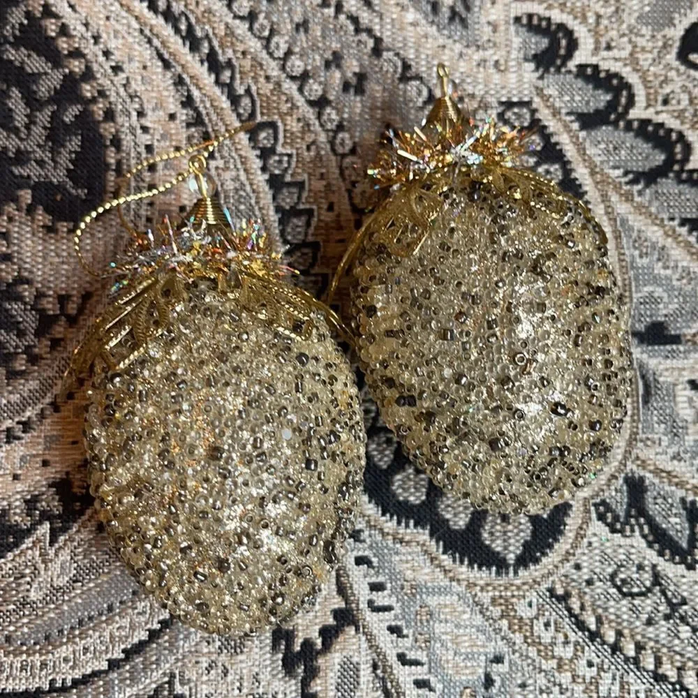 TWO LIGHT gold & bronze studded ornaments & fringe